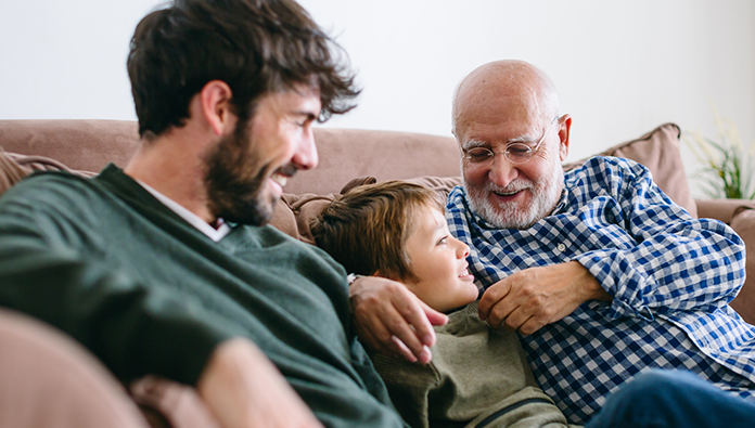 Three generations sitting on a couch Three generations sitting on a couch